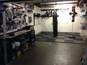 Boxing Themed Home Gym In The Garage. Perfect For Mma Types And Anyone Who Needs To Releave Some Stress.
