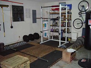 Wooden Garage Gym Flooring Padded With Extra Gym Floor Pads. Hang The Bike Up And Hit The Iron.